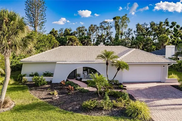 a aerial view of a house with swimming pool and garden
