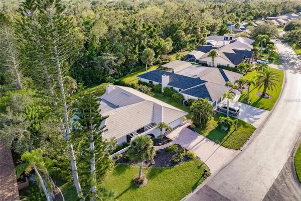 an aerial view of residential houses with outdoor space