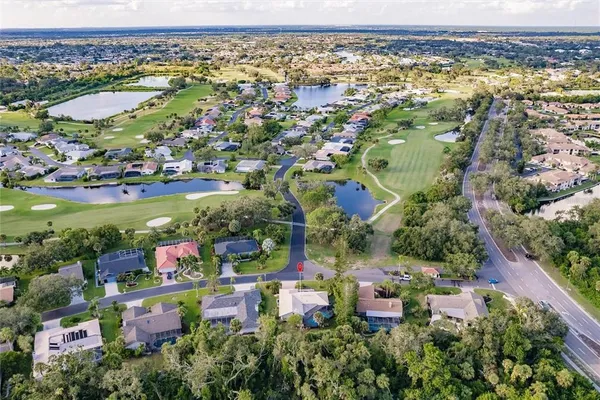 an aerial view of city and lake
