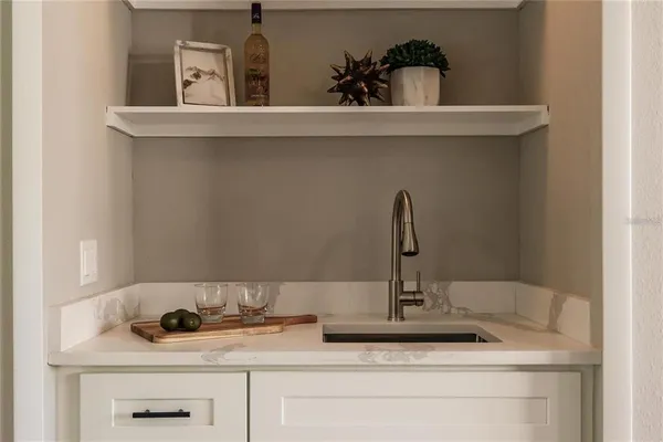 a bathroom with a sink and vanity