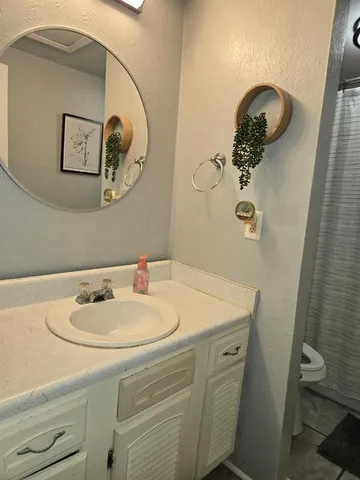 a room with furniture a window and flat screen tv