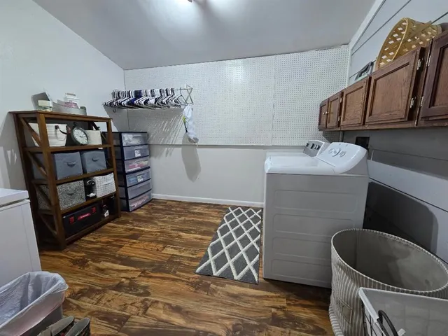a view of a dresser and cabinets in the room