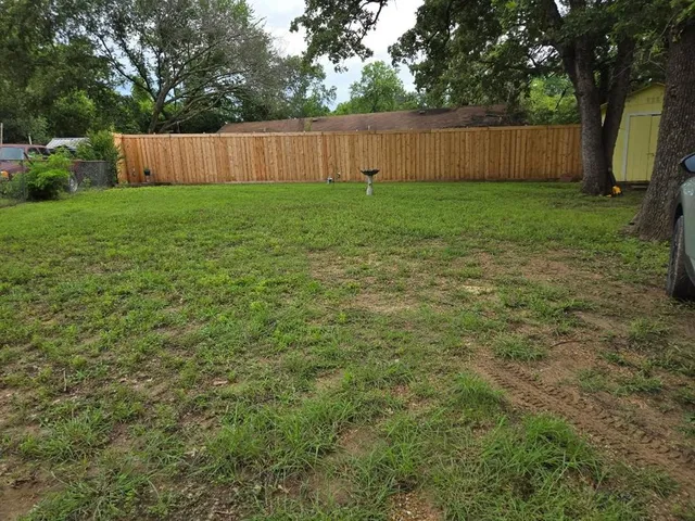 a view of a livingroom with workspace and a window