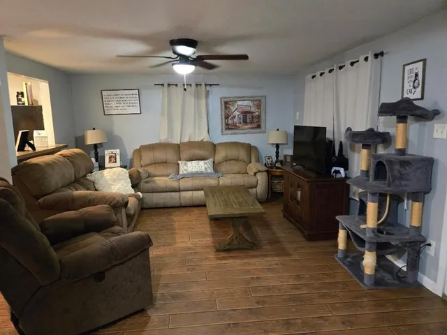 a kitchen with stainless steel appliances granite countertop a refrigerator and a stove
