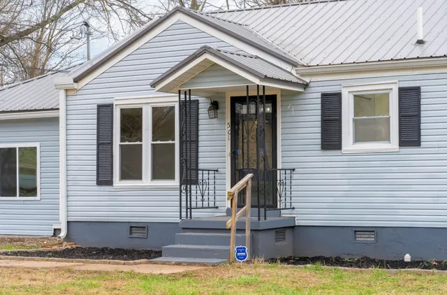 a front view of a house with swimming pool