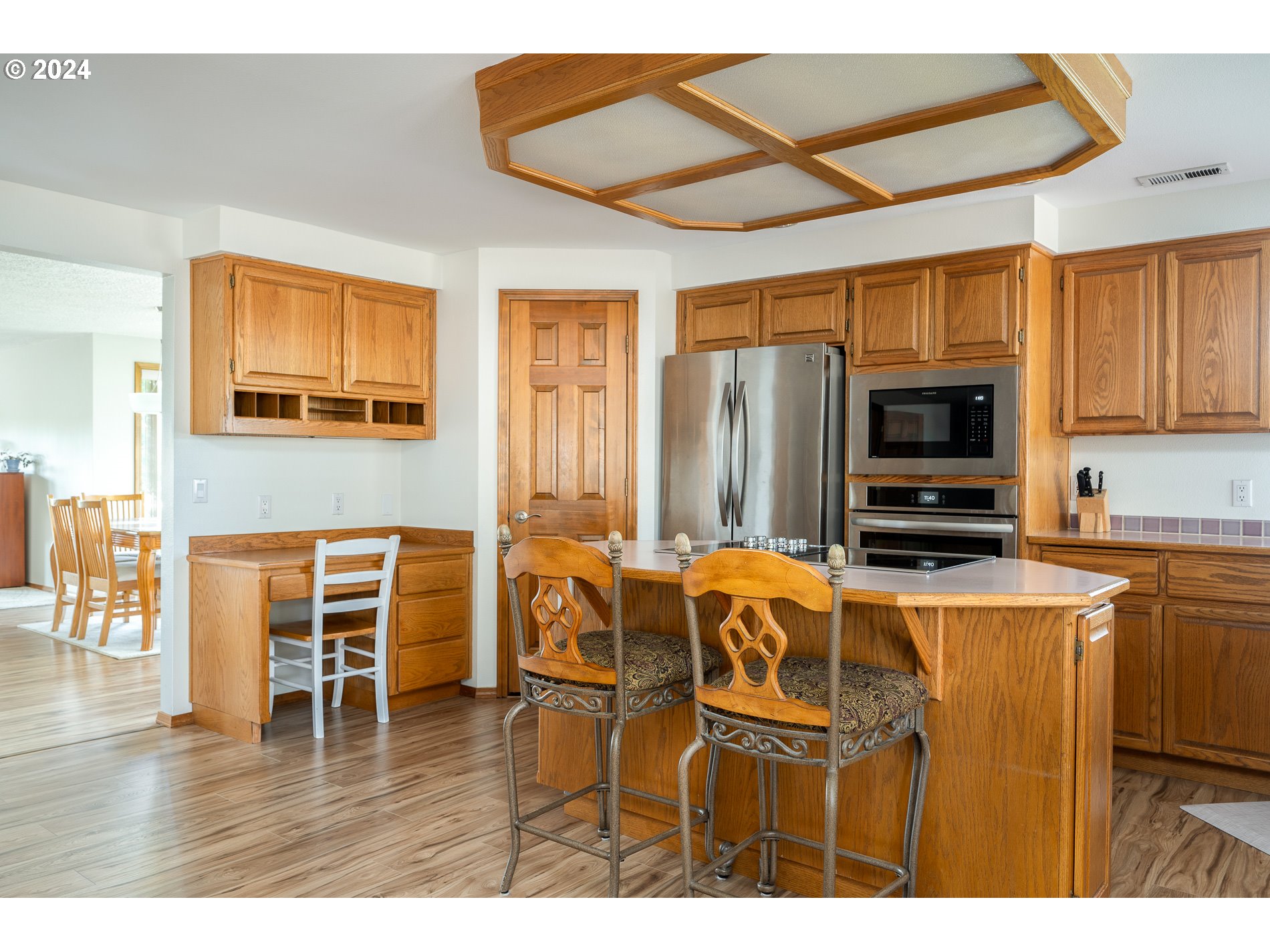 1908 Northwest 140th Circle Vancouver, WA 98685 - Photo 16 of 46 a kitchen with stainless steel appliances kitchen island granite countertop a stove and a microwave