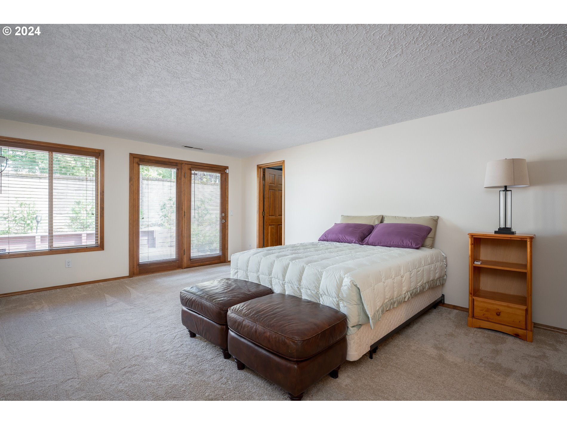 1908 Northwest 140th Circle Vancouver, WA 98685 - Photo 17 of 46 a spacious bedroom with a bed and a couch