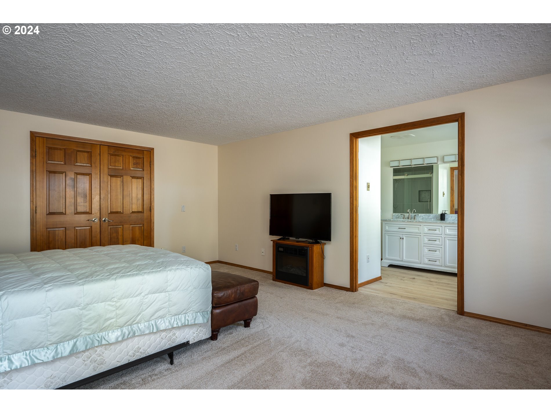 1908 Northwest 140th Circle Vancouver, WA 98685 - Photo 19 of 46 a bedroom with a bed and a television in it