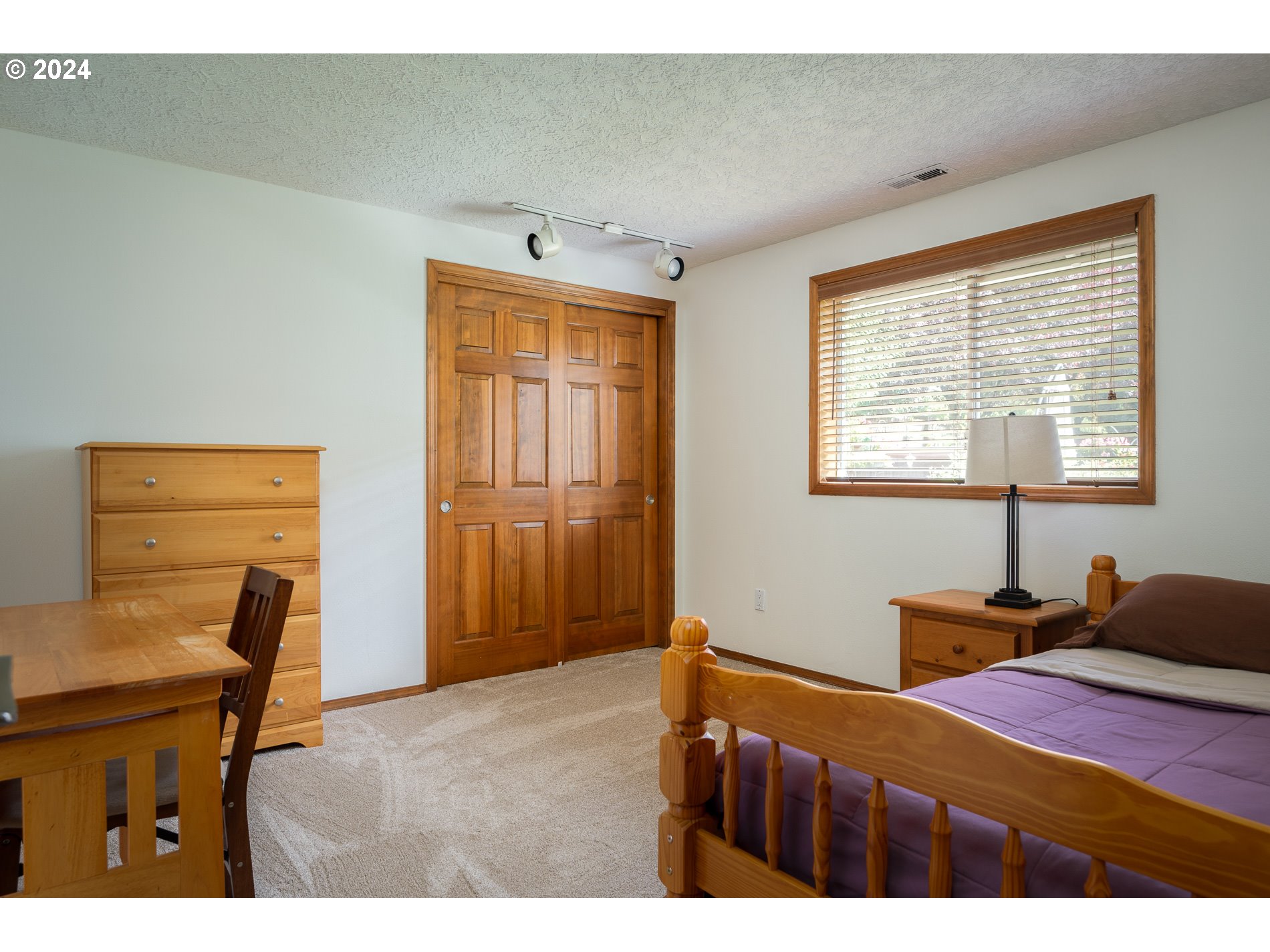 1908 Northwest 140th Circle Vancouver, WA 98685 - Photo 24 of 46 a bedroom with a bed and wooden floor