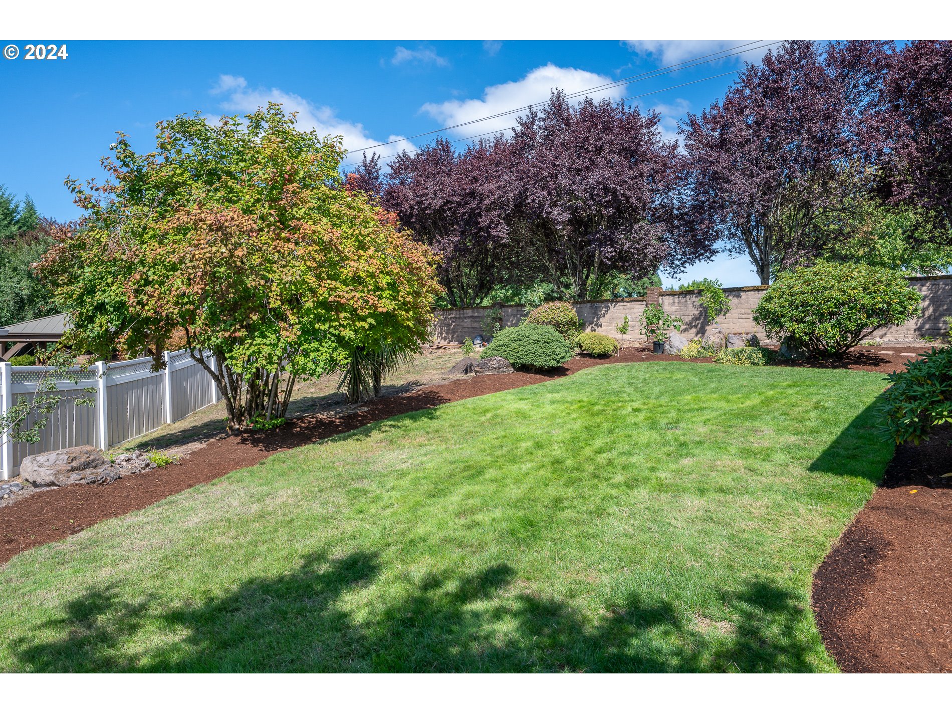 1908 Northwest 140th Circle Vancouver, WA 98685 - Photo 32 of 46 a view of a backyard with plants and a garden