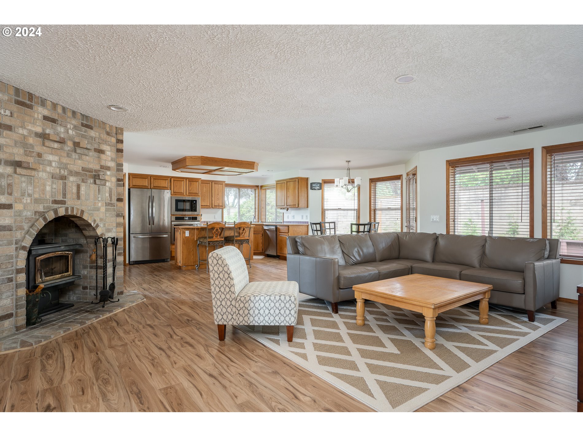 1908 Northwest 140th Circle Vancouver, WA 98685 - Photo 10 of 46 a living room with furniture and a fireplace