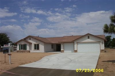 14410 Jicarilla Road Apple Valley, CA 92307 - Photo 1 of 1 a view of house and street view