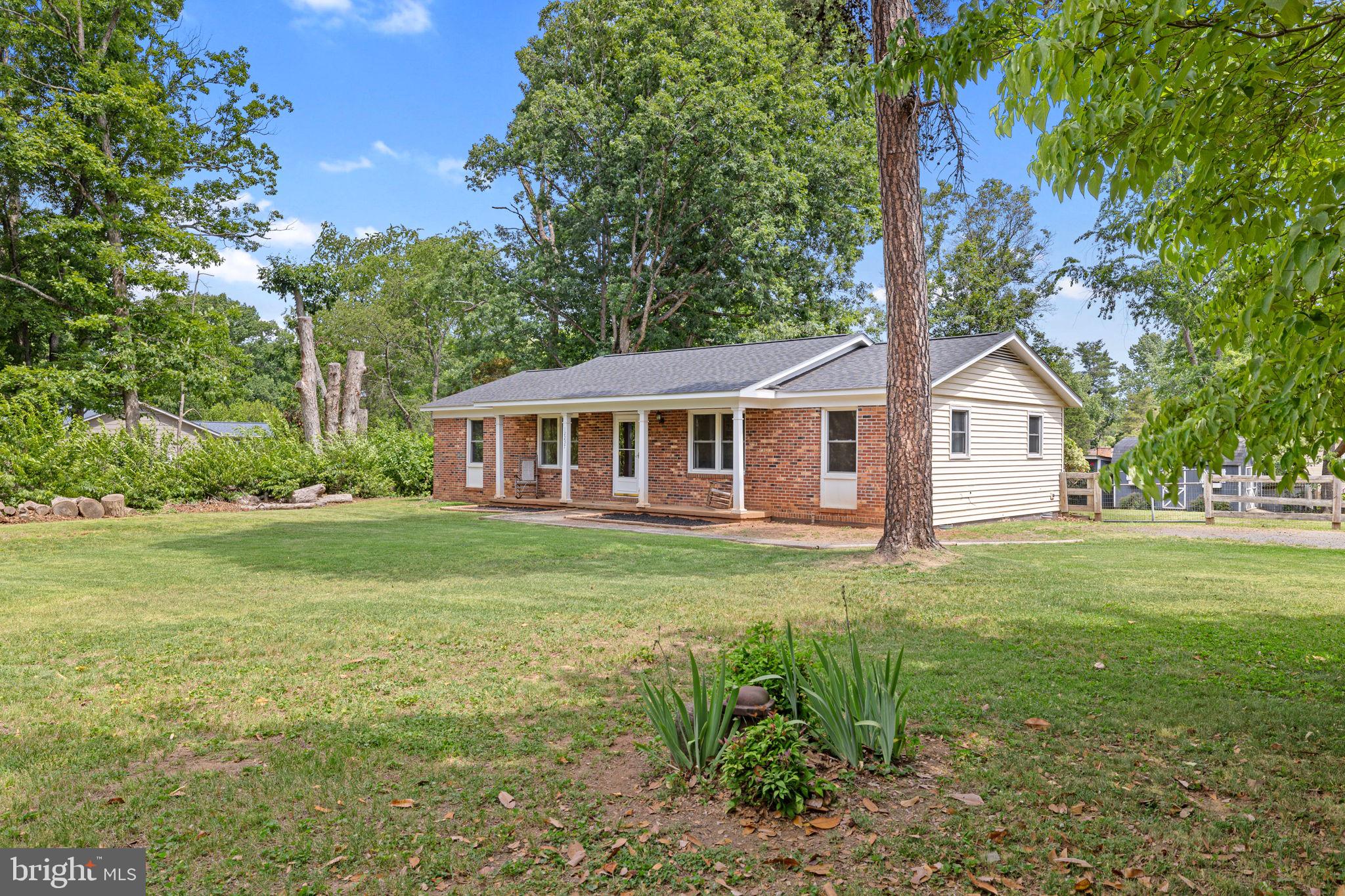 12237 Randle Lane Culpeper, VA 22701 - Photo 2 of 31 a front view of a house with a garden