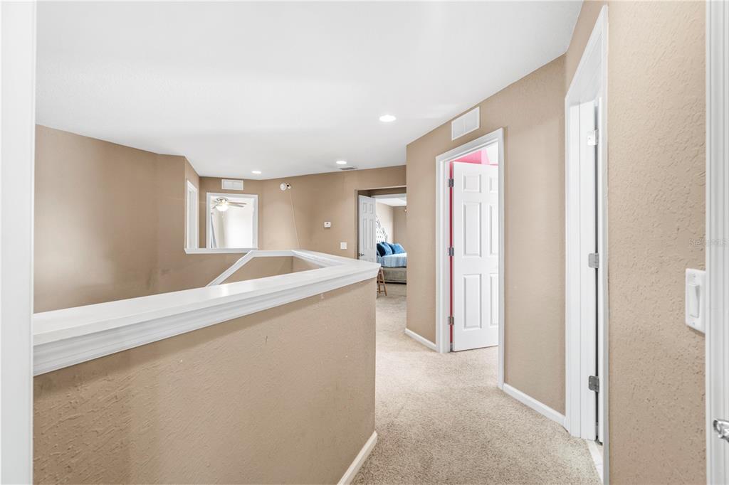 4199 Southwest 46th Court Ocala, FL 34474 - Photo 21 of 50 a room with a bed and a mirror