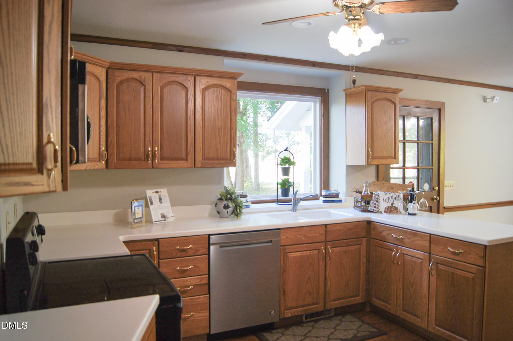 8720 Mt Pleasant Church Road Willow Spring, NC 27592 - Photo 11 of 77 a kitchen with a sink cabinets and window