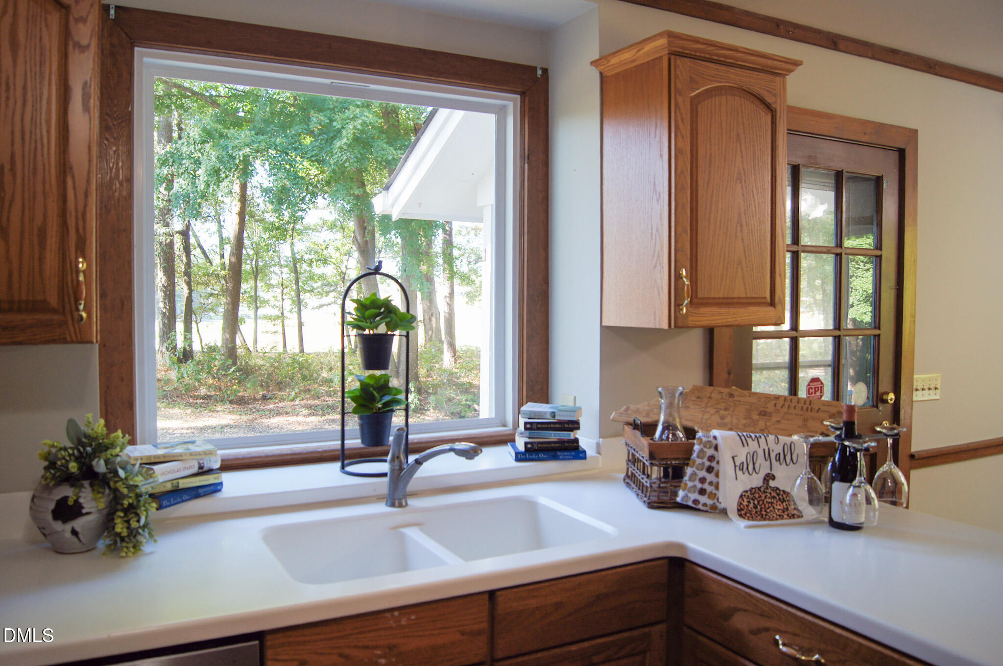 8720 Mt Pleasant Church Road Willow Spring, NC 27592 - Photo 12 of 77 a kitchen with a sink and a large window