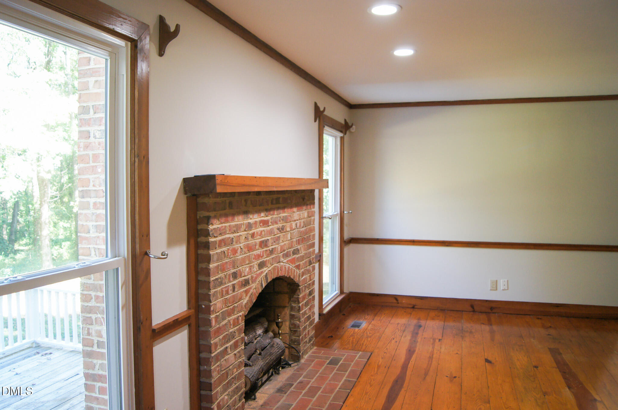 8720 Mt Pleasant Church Road Willow Spring, NC 27592 - Photo 21 of 77 a view of empty room with wooden floor and fan