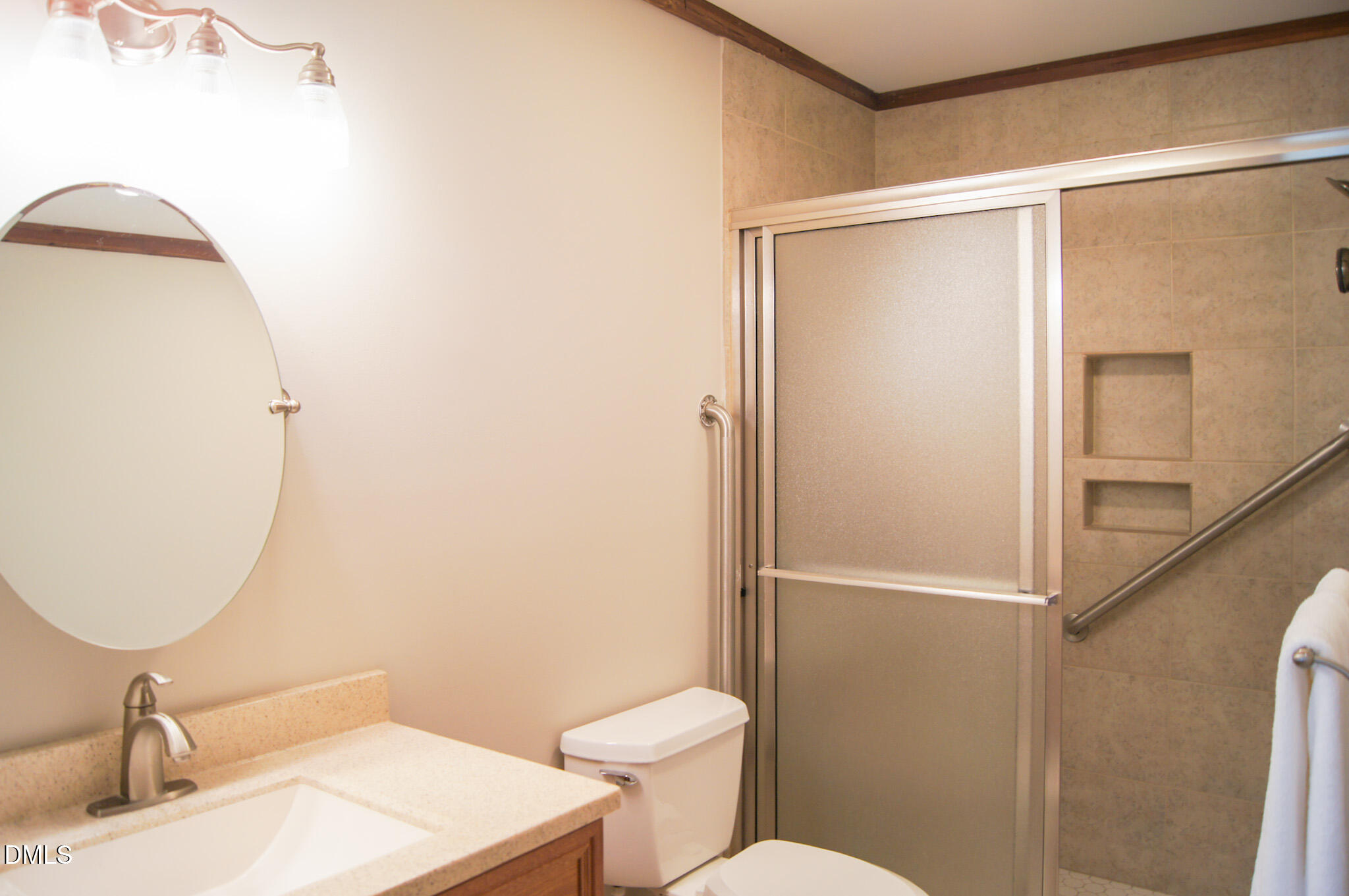 8720 Mt Pleasant Church Road Willow Spring, NC 27592 - Photo 27 of 77 a bathroom with a sink mirror vanity and toilet