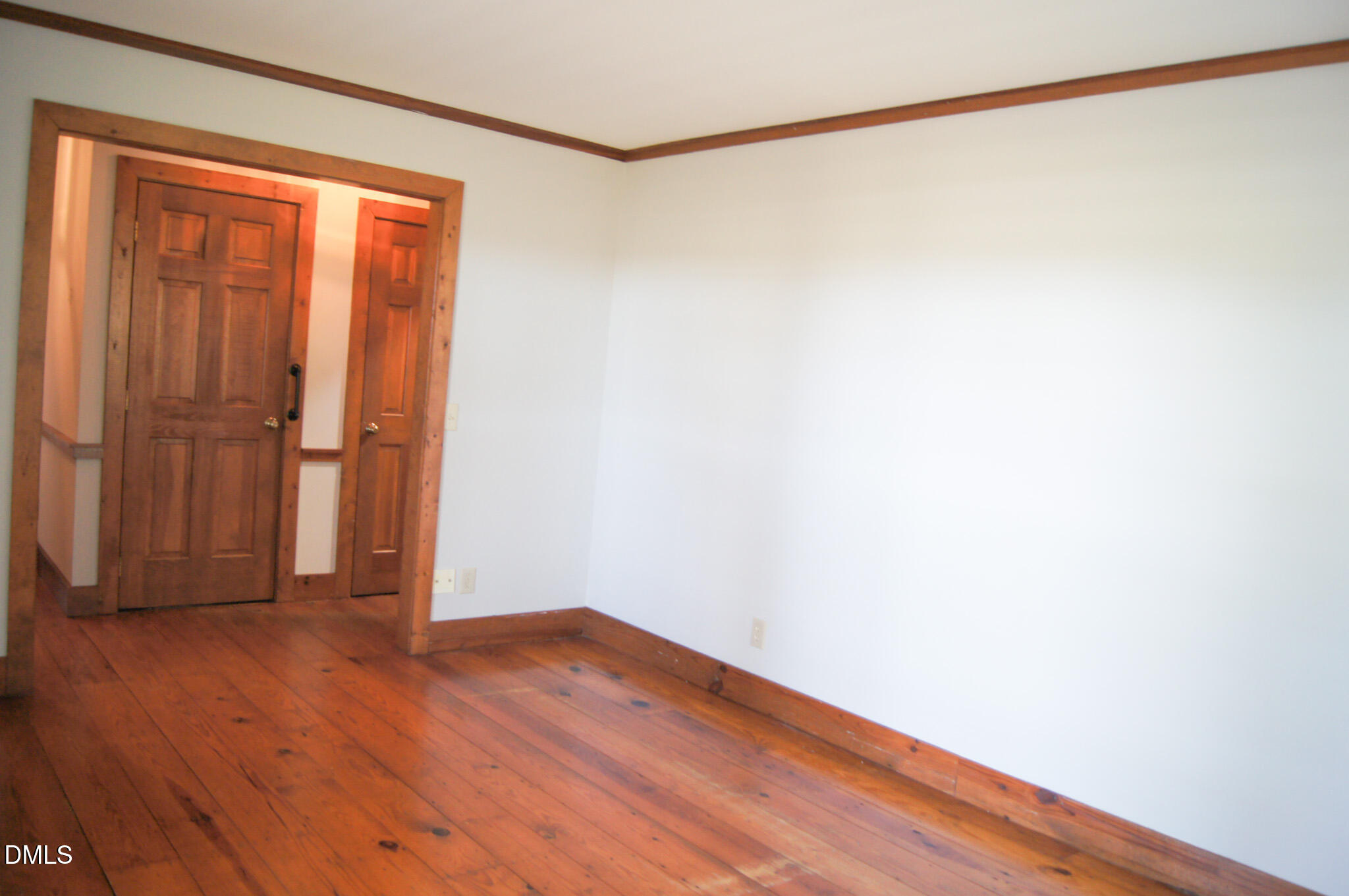 8720 Mt Pleasant Church Road Willow Spring, NC 27592 - Photo 32 of 77 a view of an empty room with wooden floor and a window
