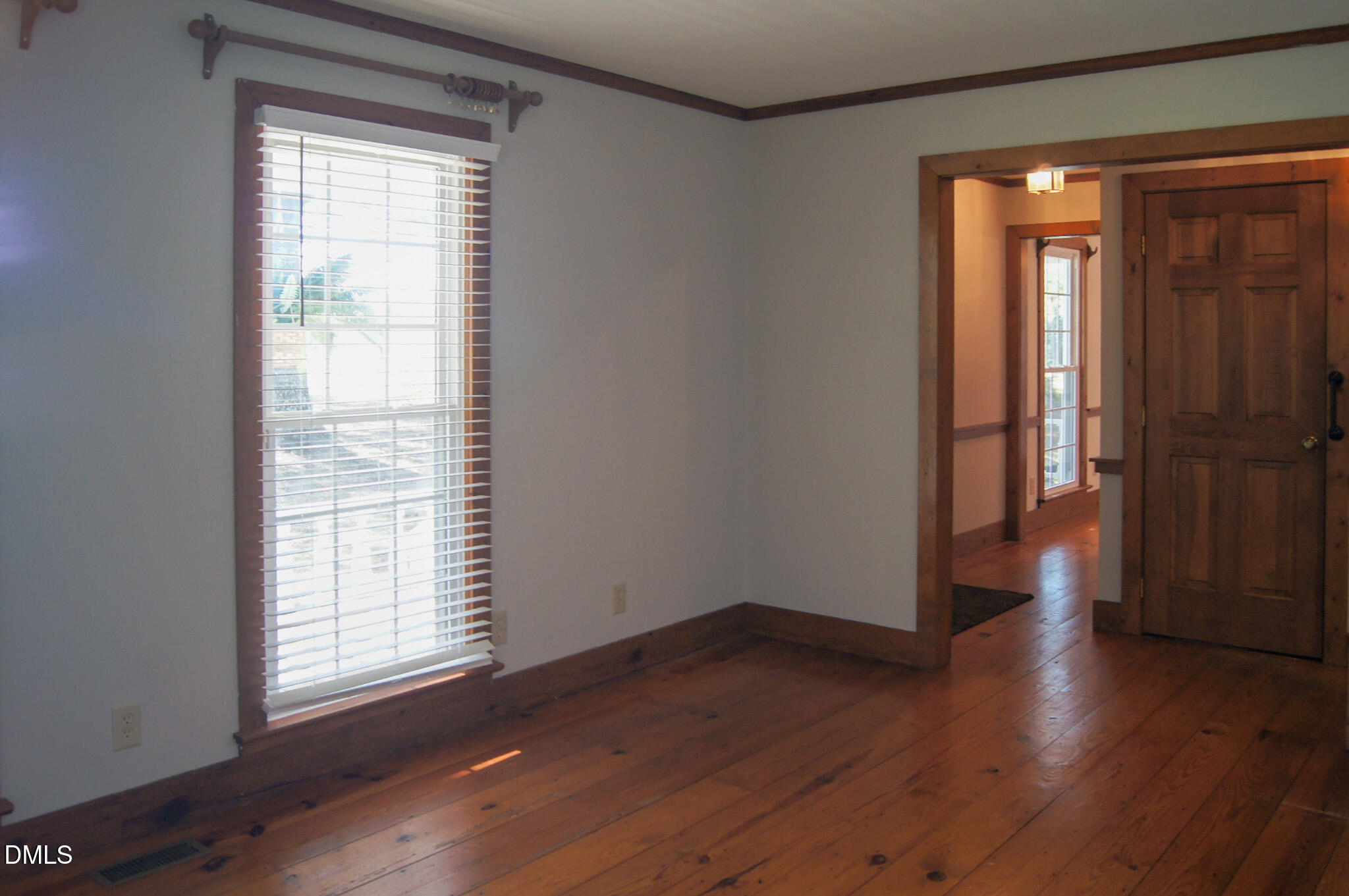 8720 Mt Pleasant Church Road Willow Spring, NC 27592 - Photo 33 of 77 an empty room with wooden floor and a window