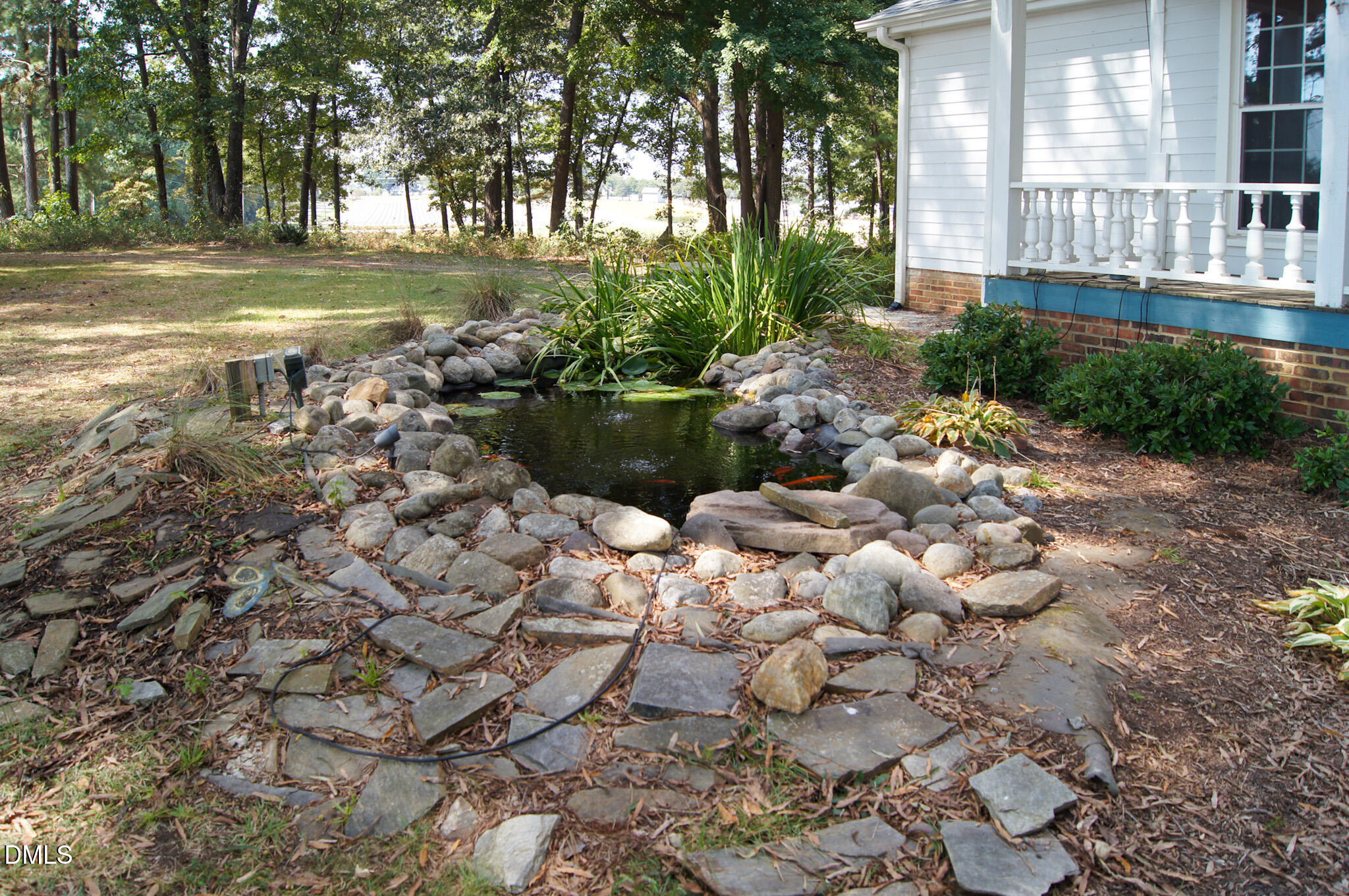 8720 Mt Pleasant Church Road Willow Spring, NC 27592 - Photo 5 of 77 a view of a lake with a yard