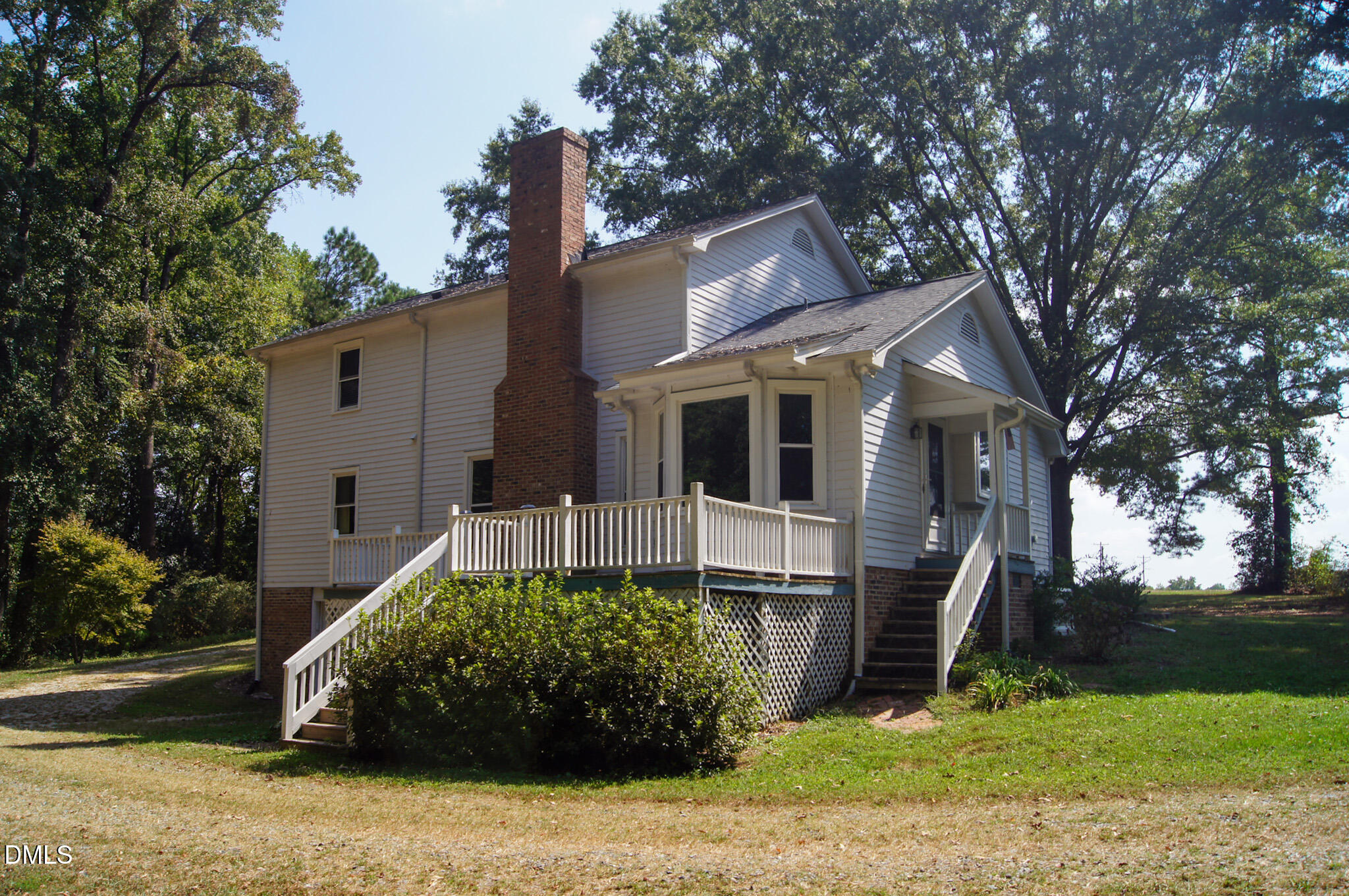 8720 Mt Pleasant Church Road Willow Spring, NC 27592 - Photo 61 of 77 a front view of a house with a yard