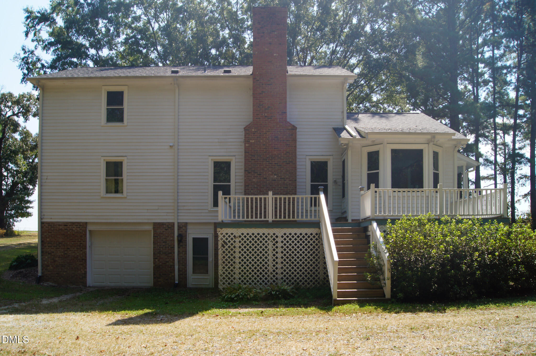 8720 Mt Pleasant Church Road Willow Spring, NC 27592 - Photo 62 of 77 a front view of a house with a garden