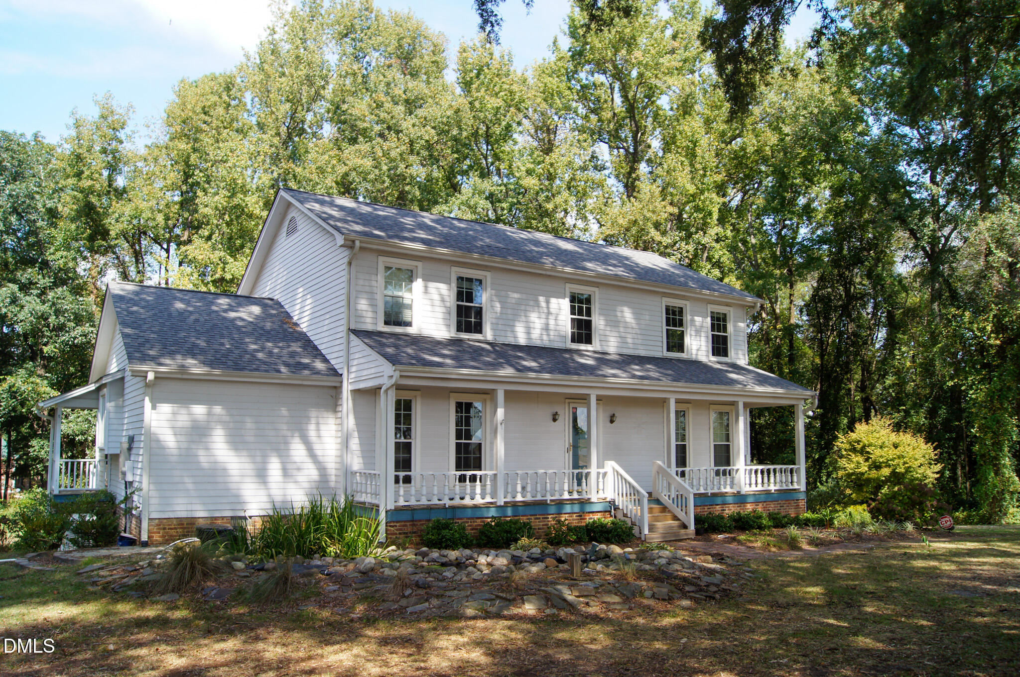 8720 Mt Pleasant Church Road Willow Spring, NC 27592 - Photo 72 of 77 a front view of a house with garden