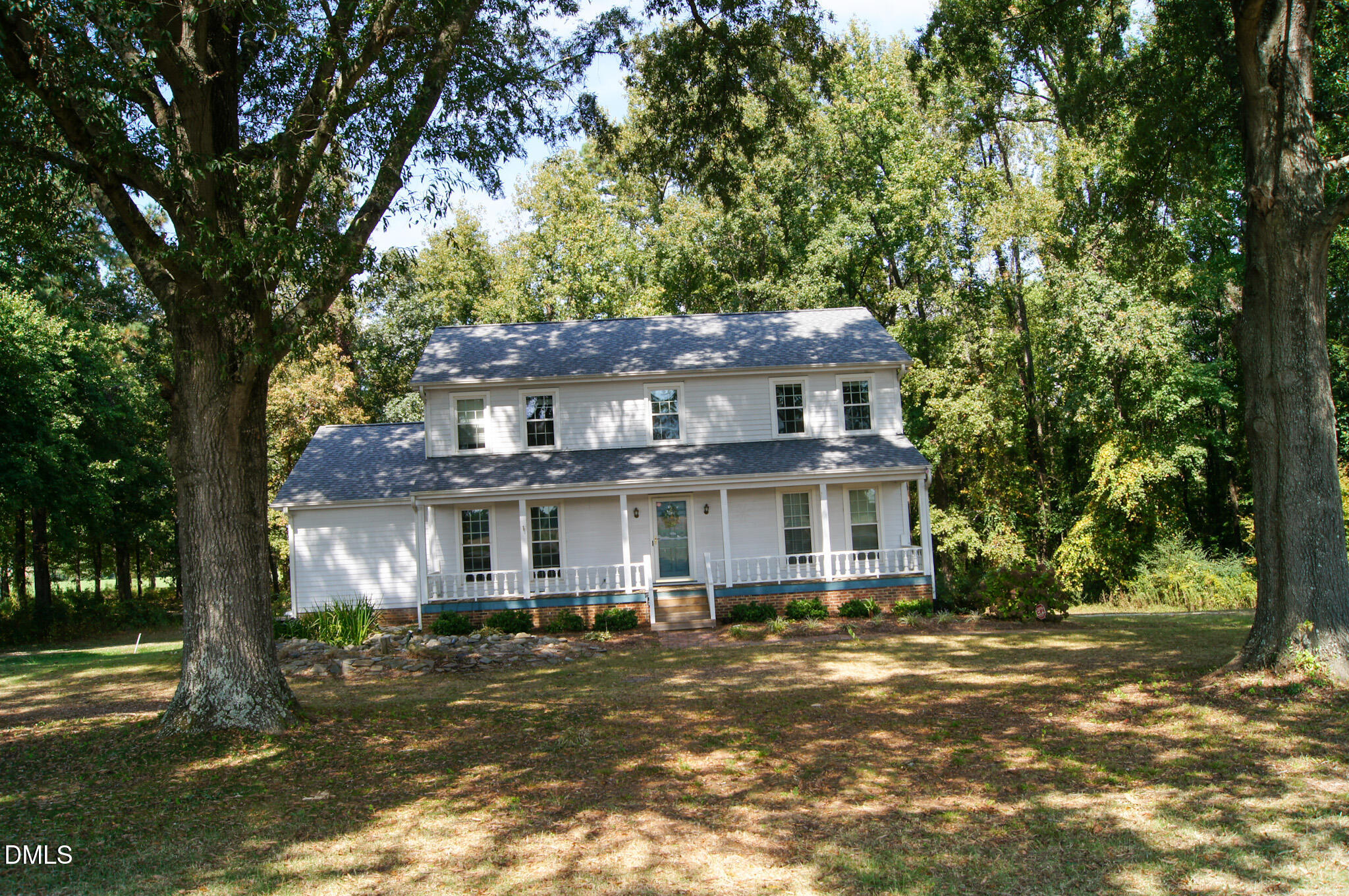 8720 Mt Pleasant Church Road Willow Spring, NC 27592 - Photo 74 of 77 a front view of a house with a yard