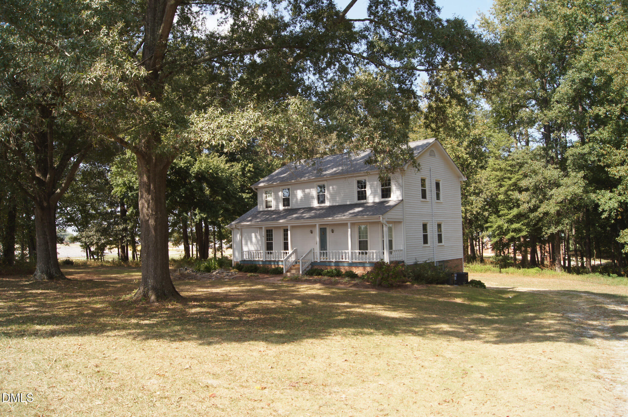 8720 Mt Pleasant Church Road Willow Spring, NC 27592 - Photo 75 of 77 a front view of a building with a lot of trees
