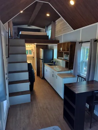 a view of room with window and wooden floor