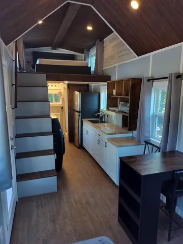 a view of room with window and wooden floor