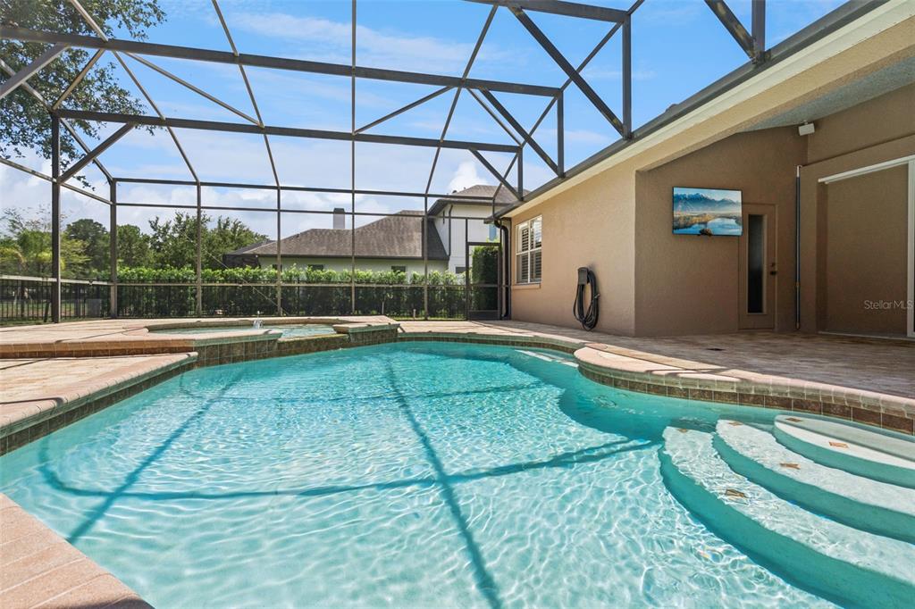 2230 Ridgewind Way Windermere, FL 34786 - Photo 34 of 38 a swimming pool with barbeque oven in front of it