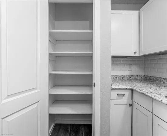 a kitchen with a cabinets and a stove