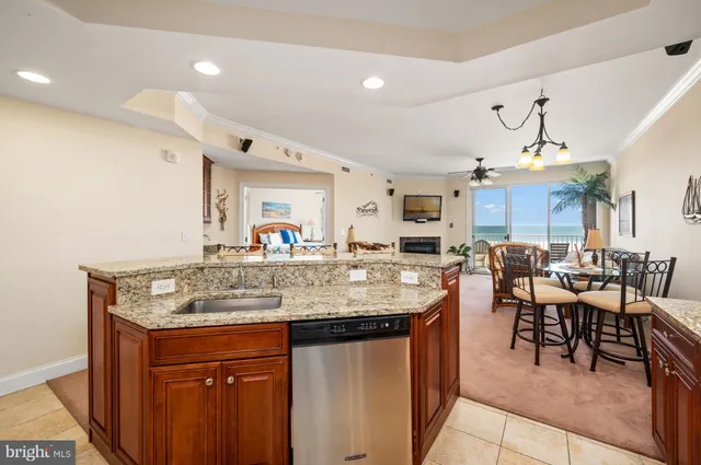 a kitchen with center island table and chairs