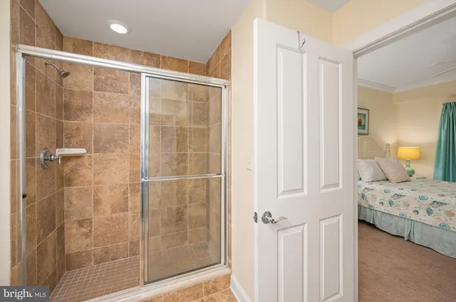 a bedroom with a bed and a mirror