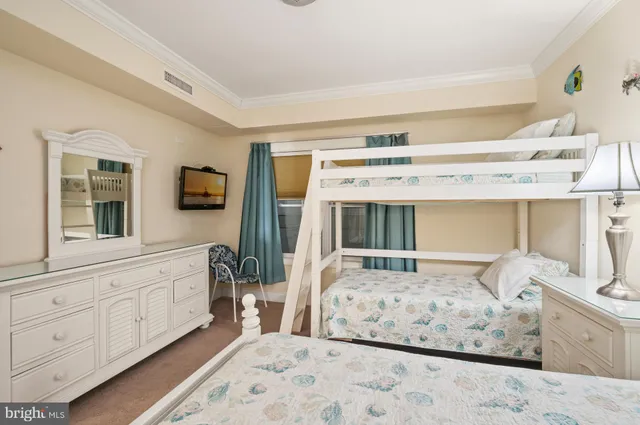 a bedroom with bed and window