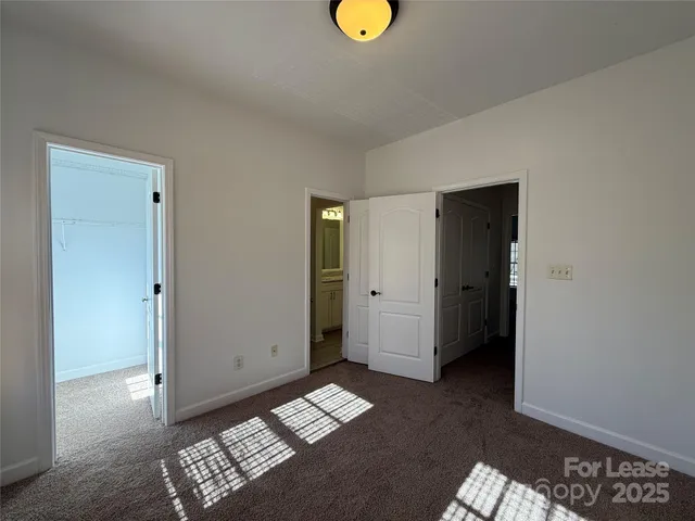 a view of room with window and lounge chair