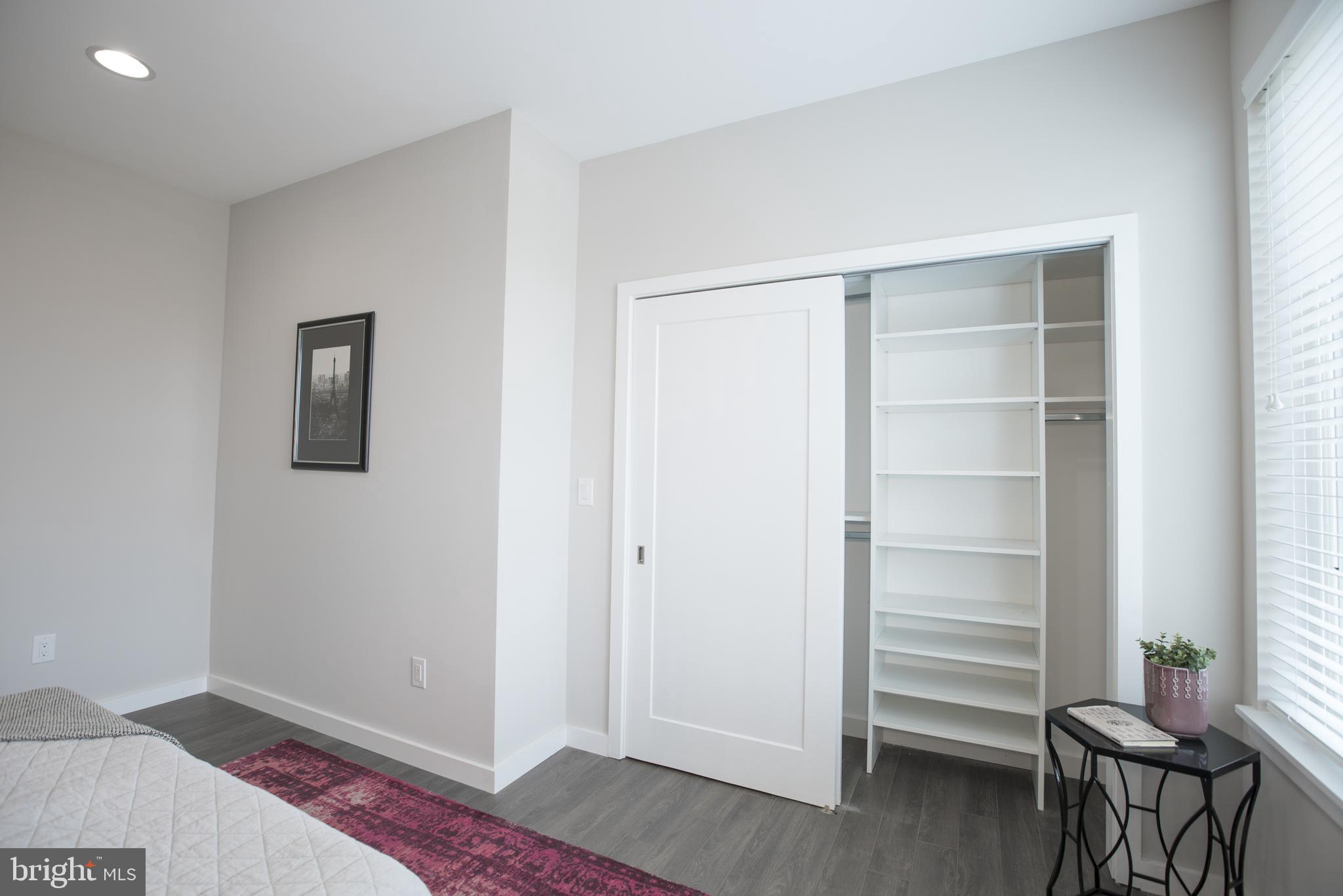 1508 Ridge Avenue, Unit 501 Philadelphia, PA 19130 - Photo 14 of 19 a view of a room with wooden floor and closet