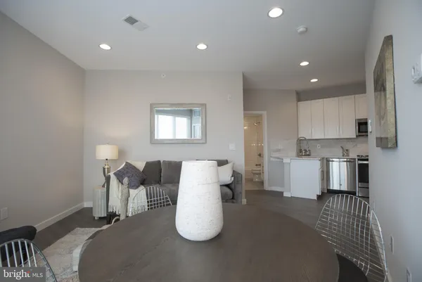 a living room with furniture and a table