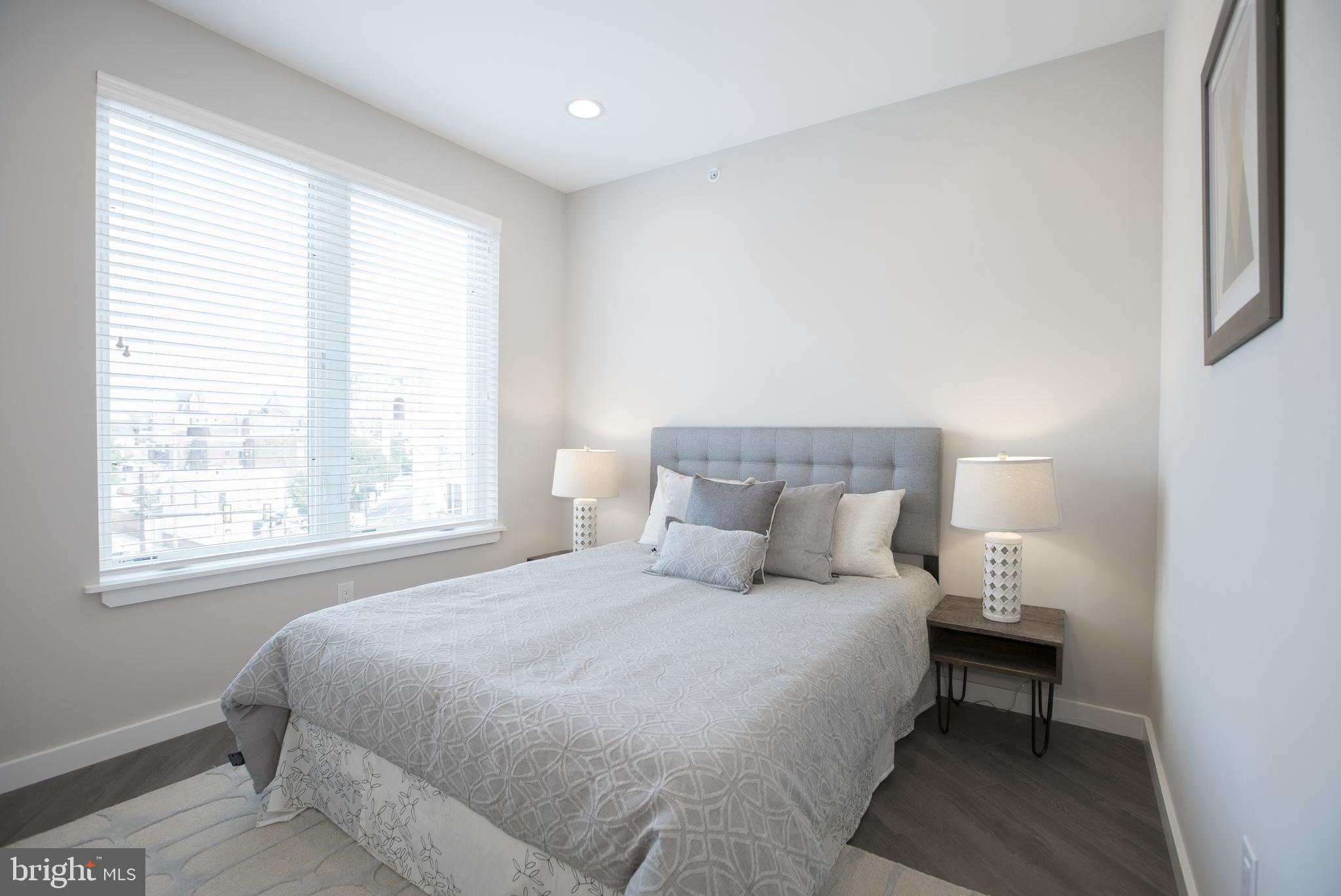 1508 Ridge Avenue, Unit 501 Philadelphia, PA 19130 - Photo 9 of 19 a bedroom with a bed and a window