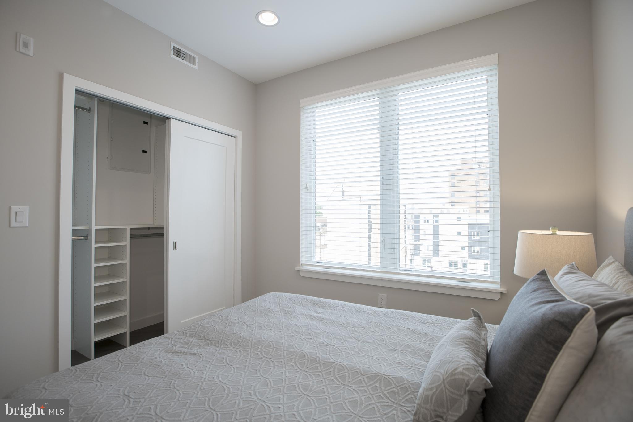 1508 Ridge Avenue, Unit 501 Philadelphia, PA 19130 - Photo 10 of 19 a bedroom with a bed and a window
