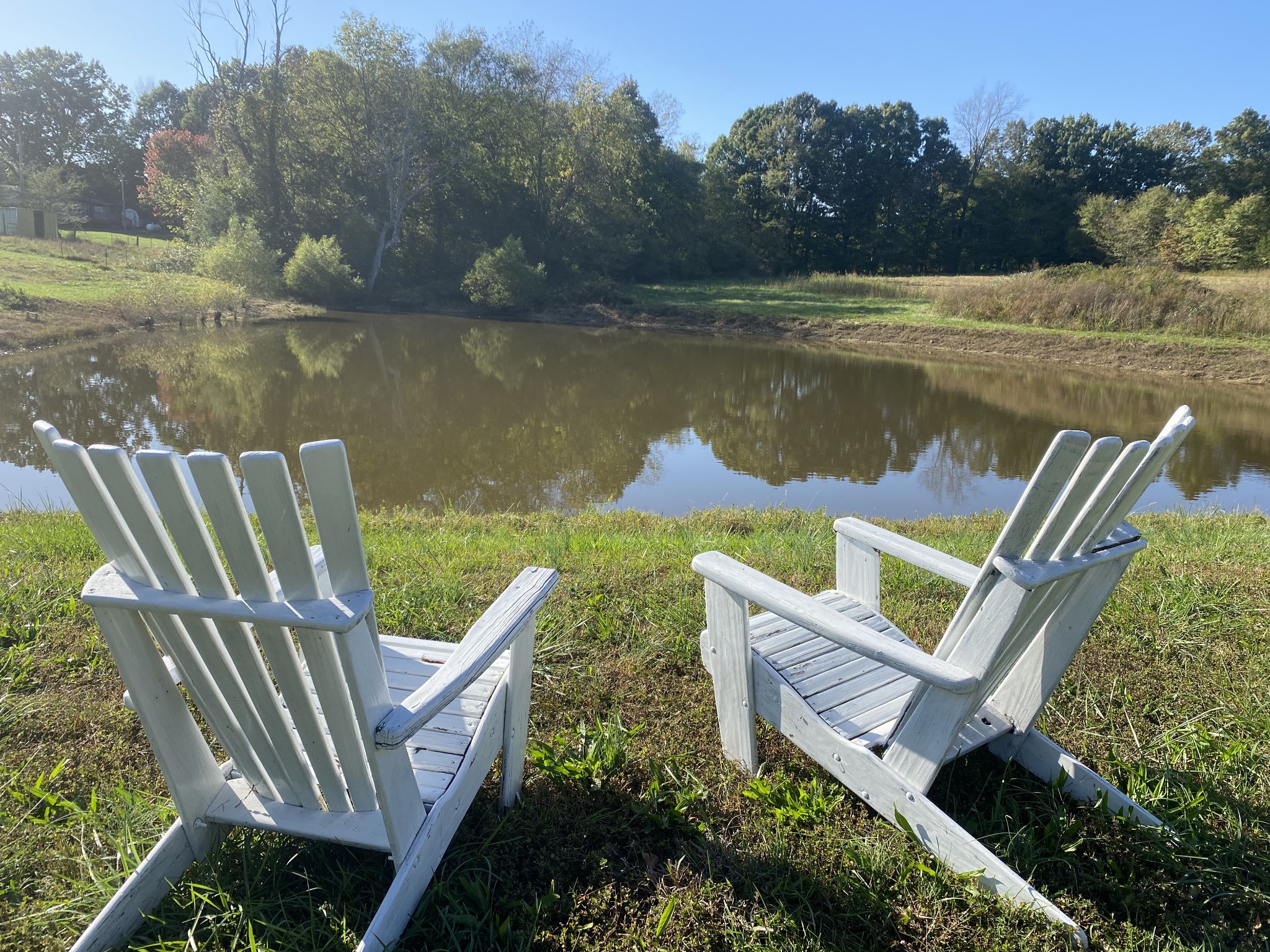 0 Dorris Road Portland, TN 37148 - Photo 1 of 24 a view of a lake with couches and wooden floor