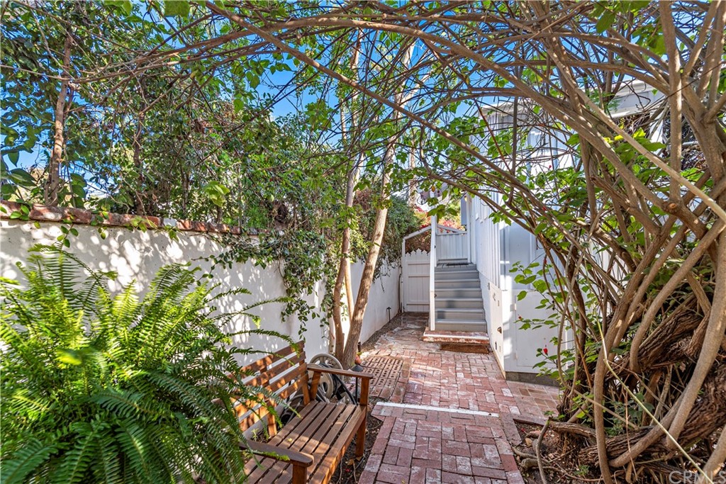429 Hawthorne Road Laguna Beach, CA 92651 - Photo 19 of 33 a pathway of a house with a tree