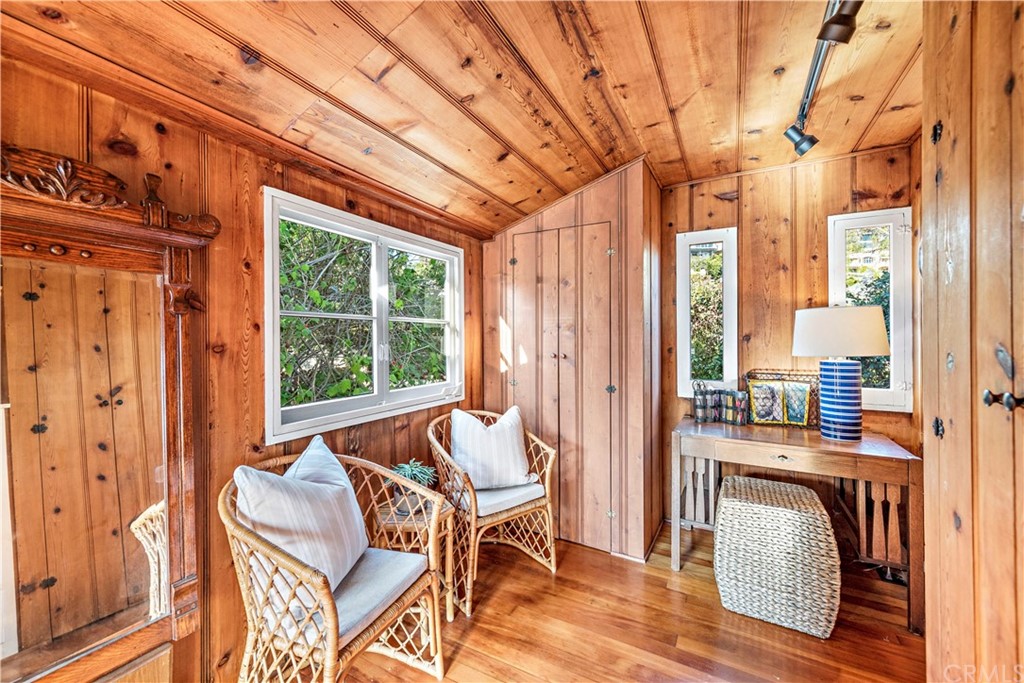 429 Hawthorne Road Laguna Beach, CA 92651 - Photo 21 of 33 a dining room with furniture and large windows