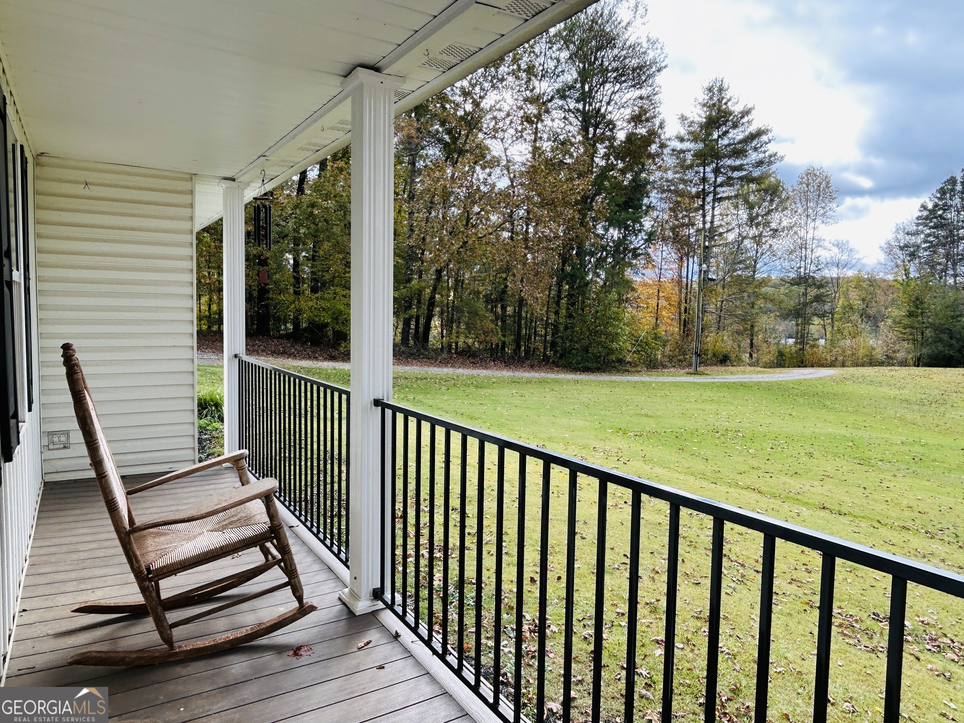 3077 Alec Mountain Road Clarkesville, GA 30523 - Photo 5 of 35 a view of a wooden deck and a backyard