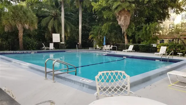 a view of a swimming pool with a patio