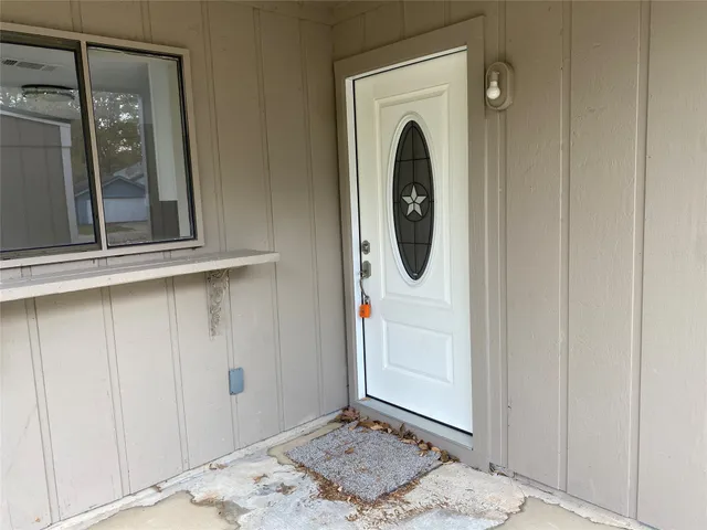 a view of a hallway with washer and dryer