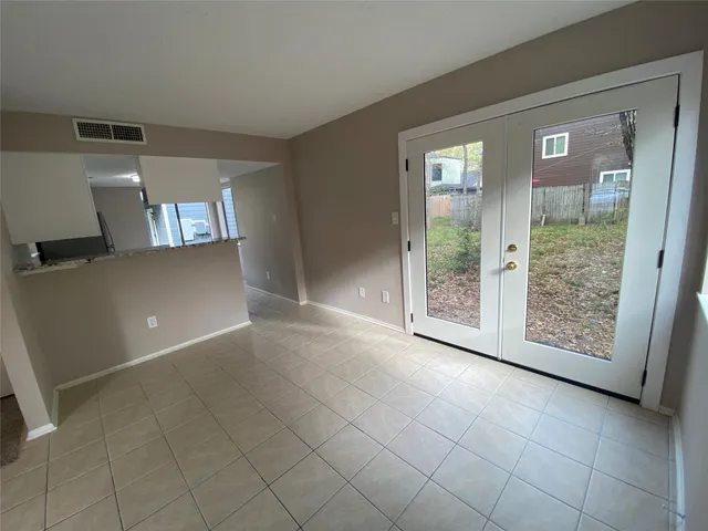a view of an empty room and window