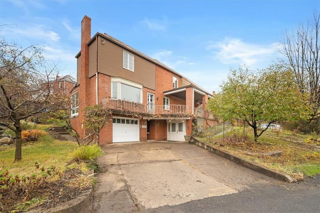 2800 Fernwald Road Pittsburgh, PA 15217 - Photo 34 of 37 a front view of a house with a yard